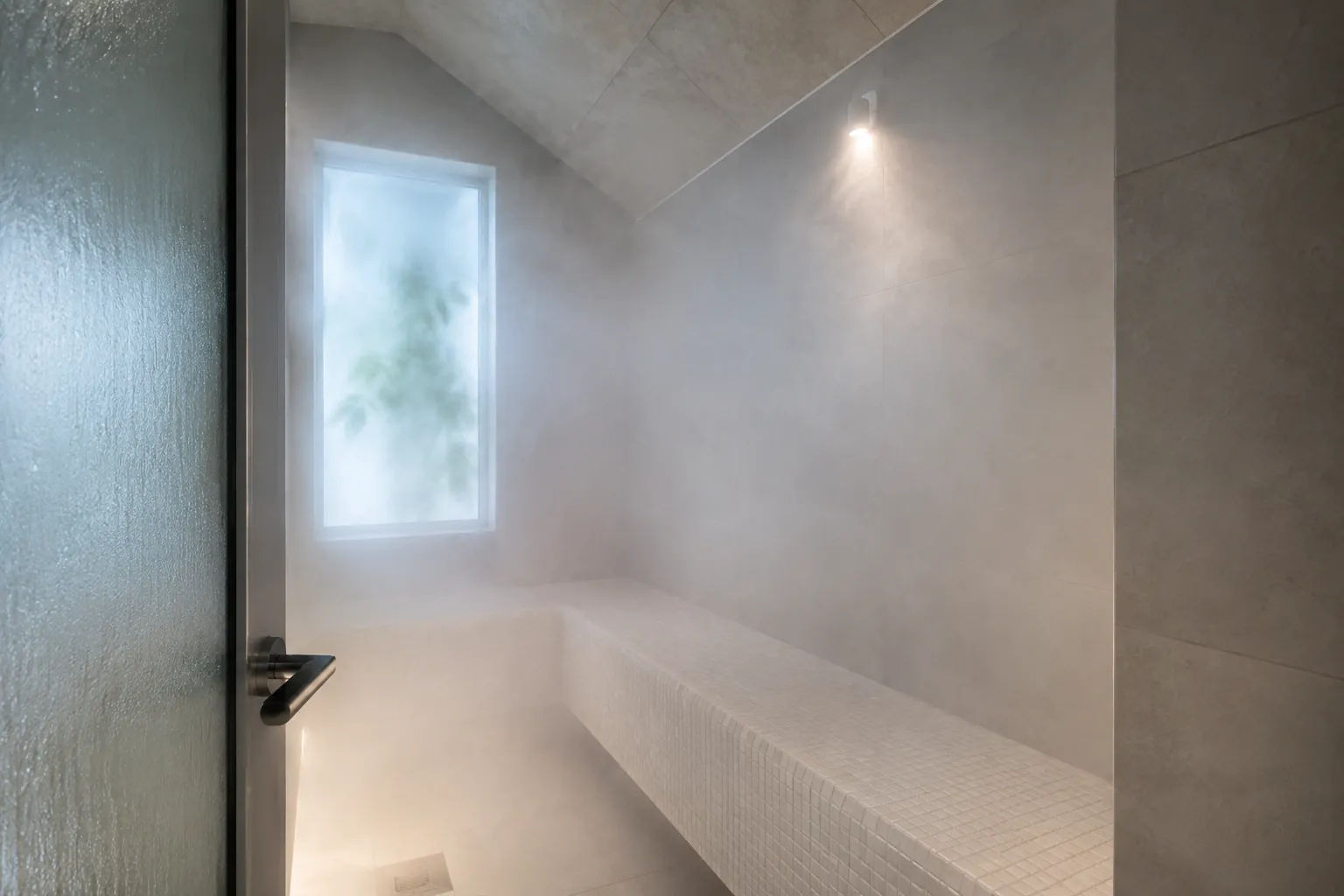Interior of a working steam room with dense steam and a tiled bench