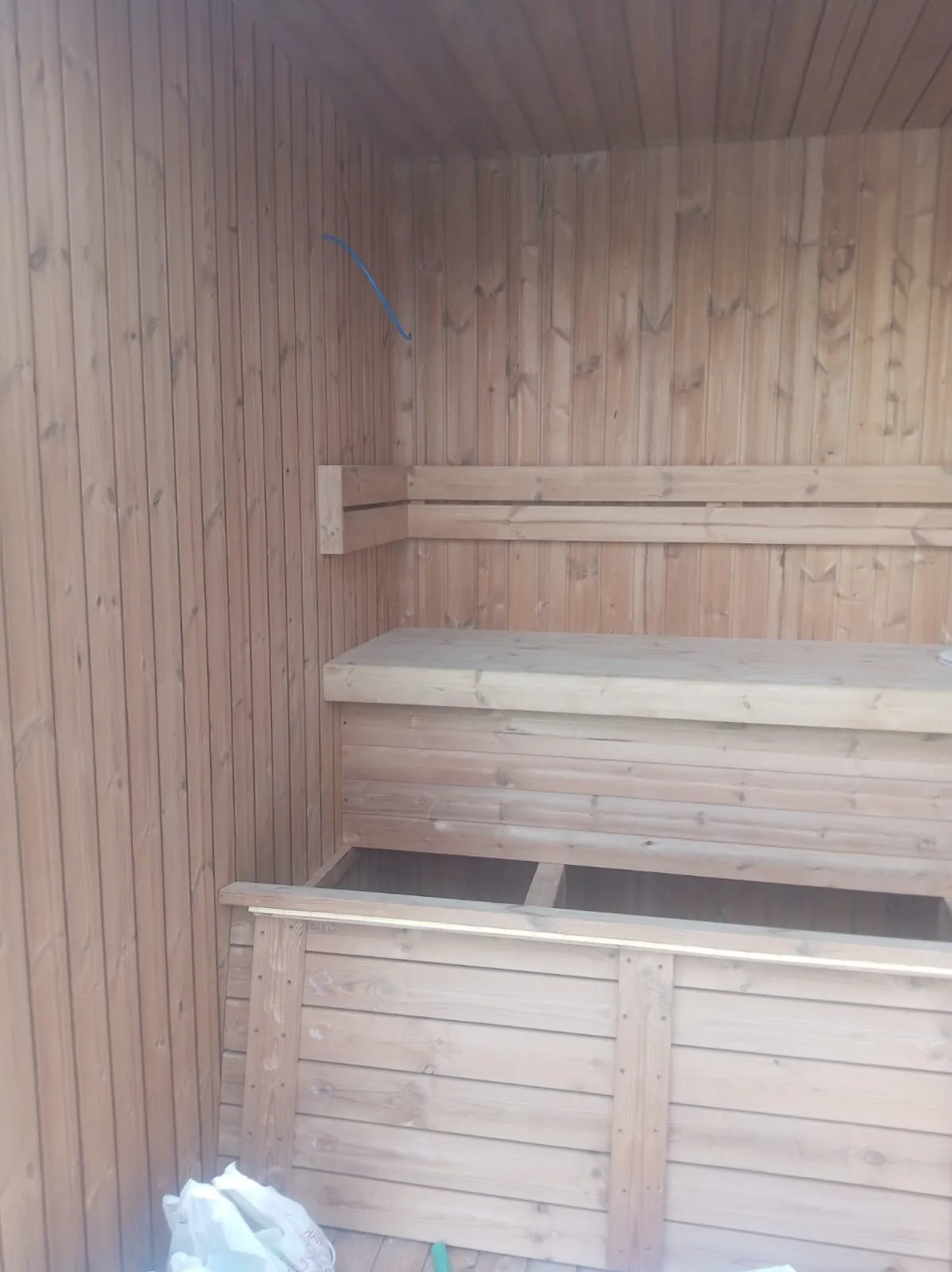 Cedar bench slats being fitted during second fix