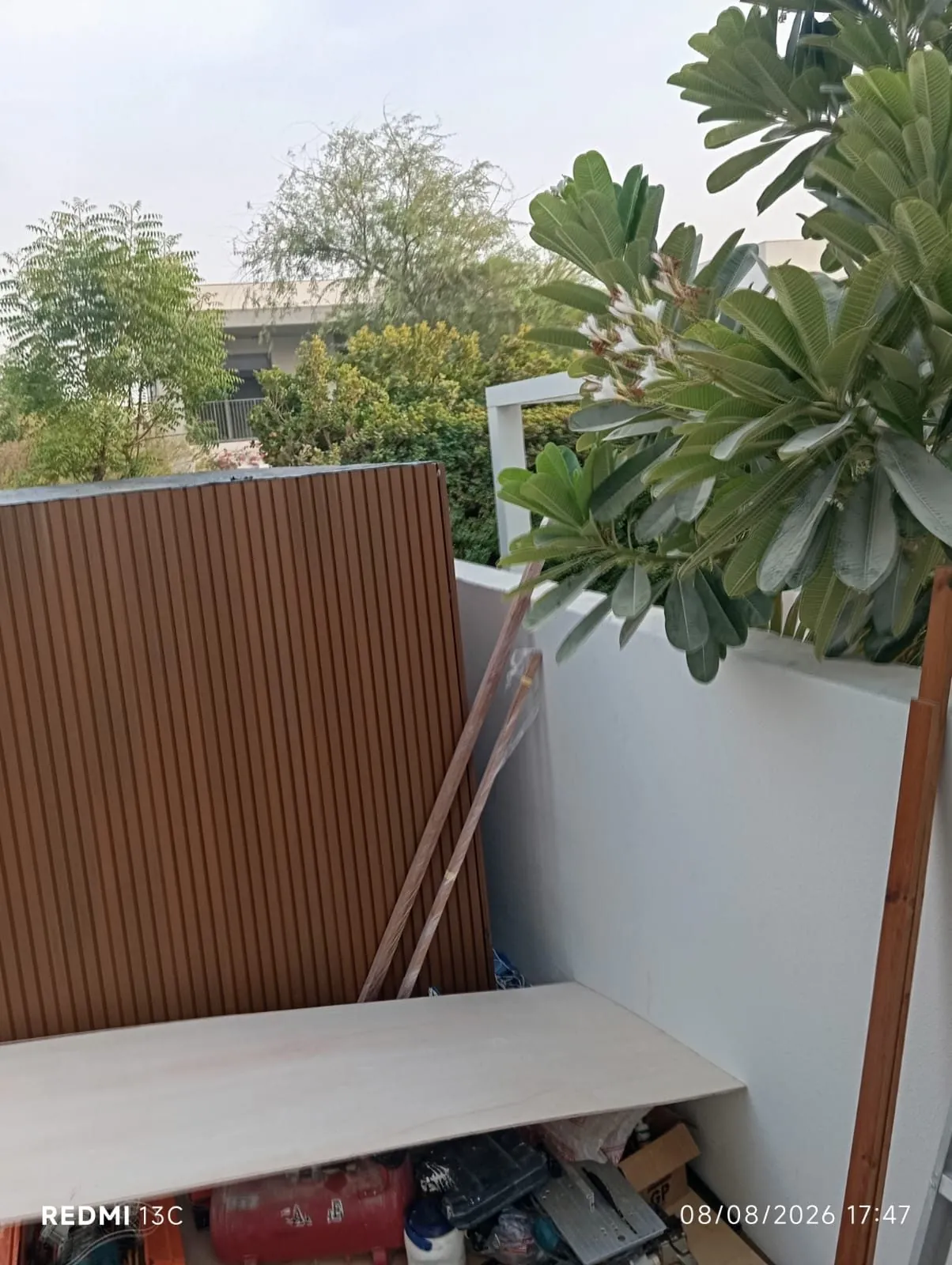 Timber screening and bench installed on a villa terrace